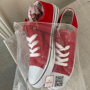 Brand new red and white sneakers.